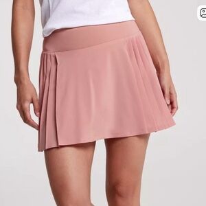 CALIA Women's 14" Side Pleat Court Skort in a pink color (Guava Pink) size M